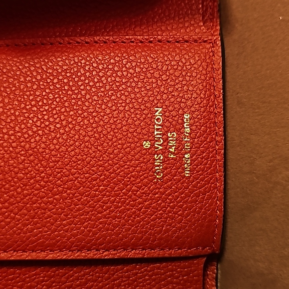 Authentic Louis Vuitton Victorine Empreinte Trifold Leather Wallet - Picture 4 of 16